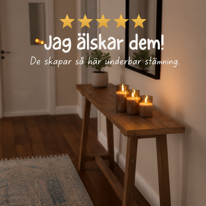 Tre tända Flamerick-blockljus i glasknoppar på en konsolbänk i hallen, med ett kundomdöme med fem stjärnor ovanpå.